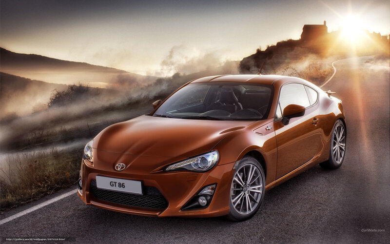 Orange Toyota GT86 on a winding road