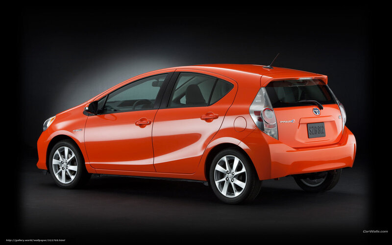 Orange Toyota Prius C — Dramatic