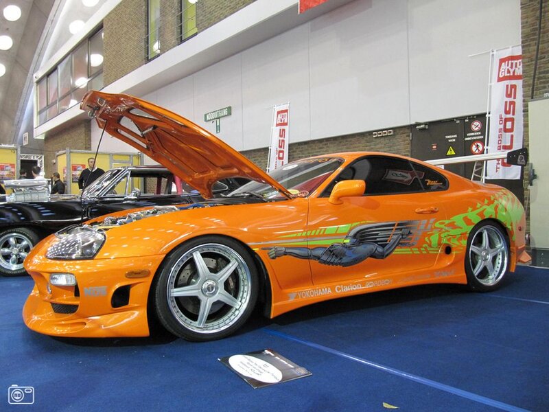 Orange Toyota Supra at car show