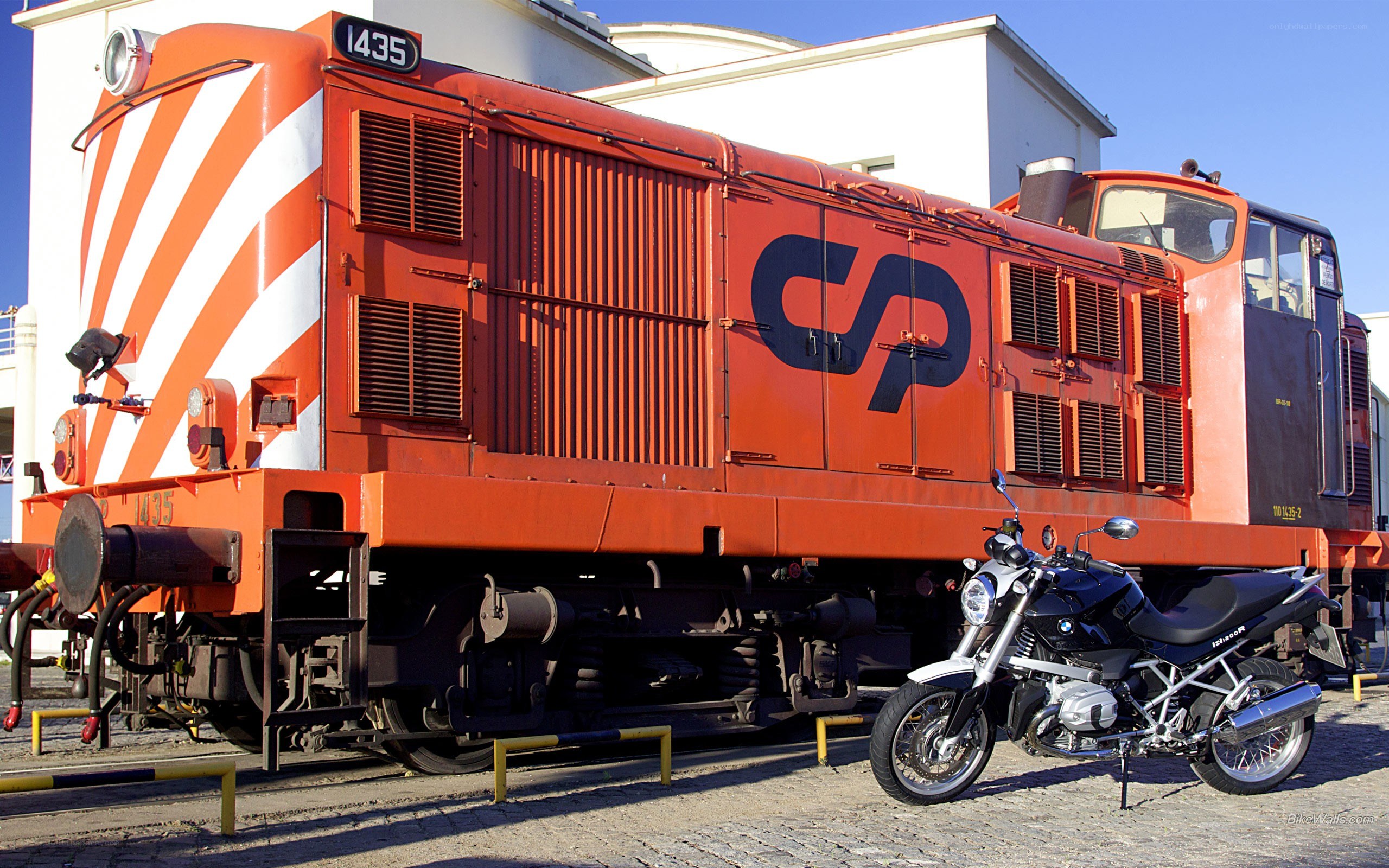 Orange train and motorcycle