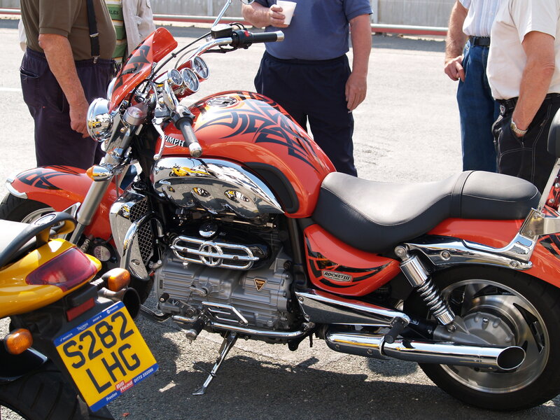 Orange Triumph motorcycle on display