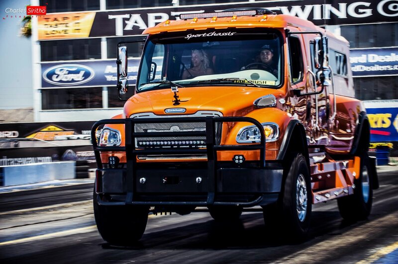 Orange truck racing on track