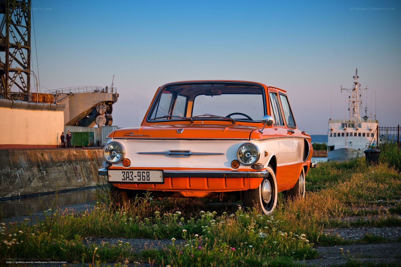Orange vintage car at harbor