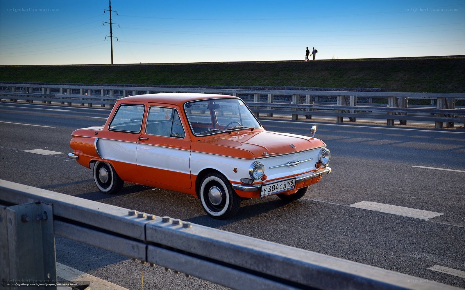 Orange vintage car on highway