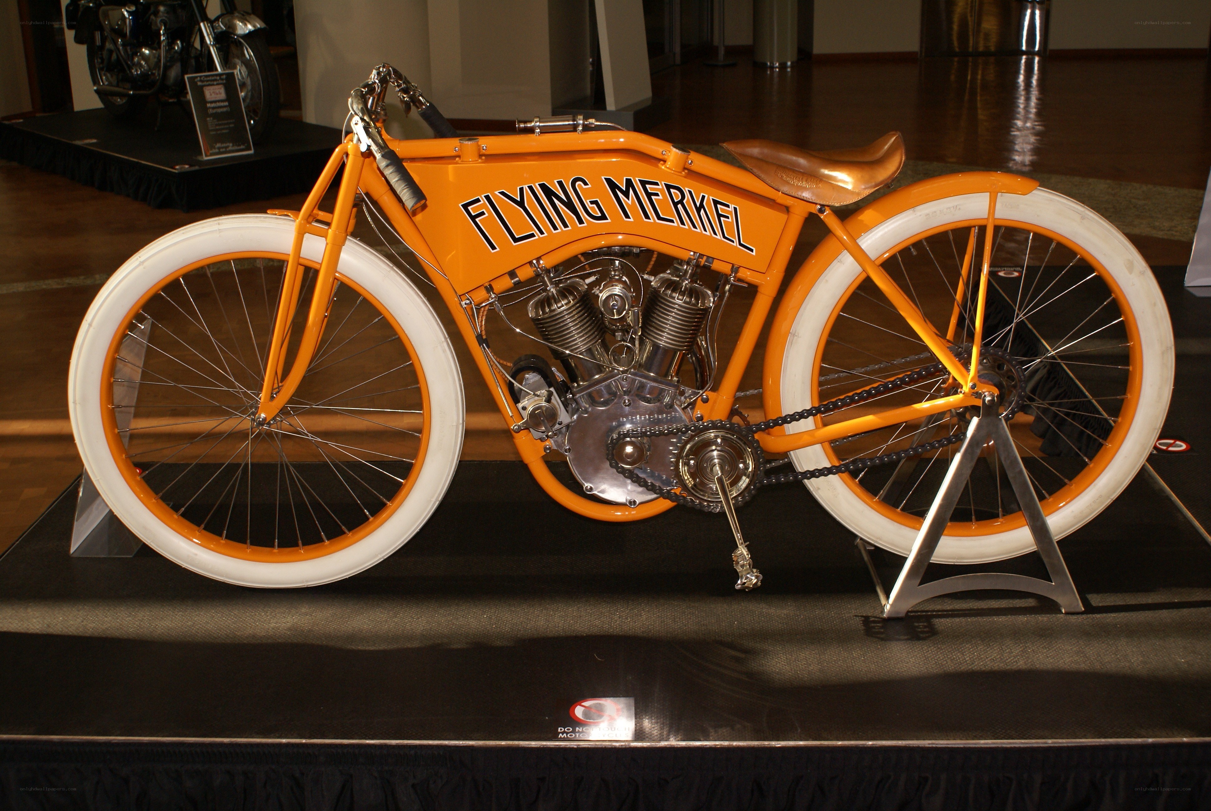 Orange vintage motorcycle on display