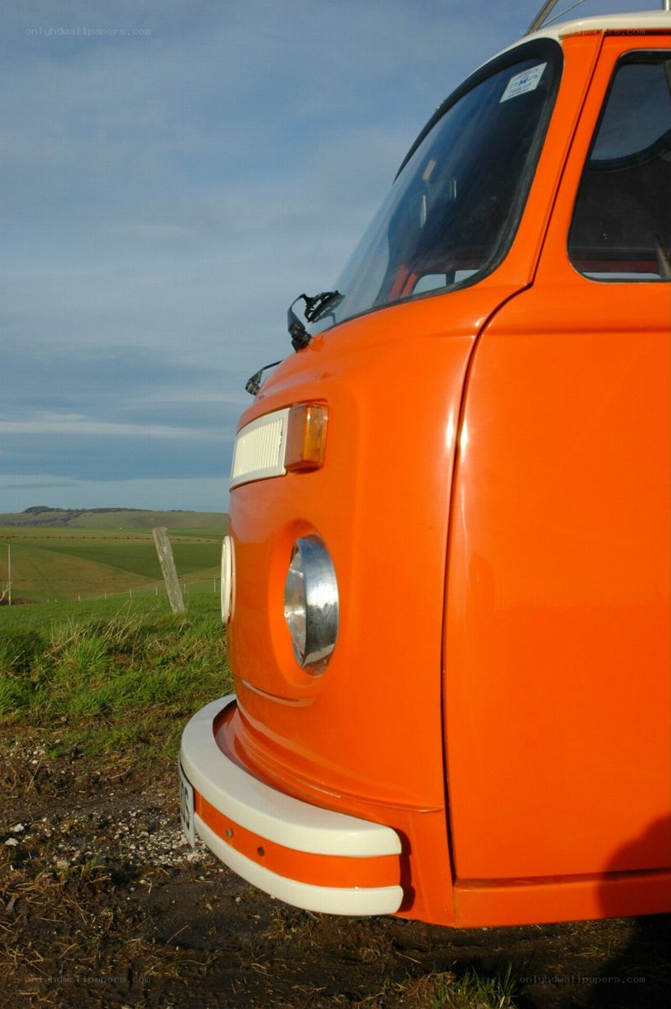 Orange vintage van in countryside