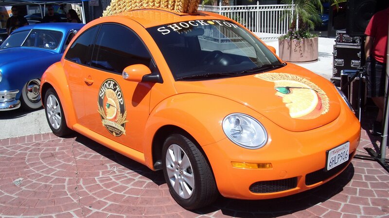 Orange Volkswagen Beetle with Shock Top branding