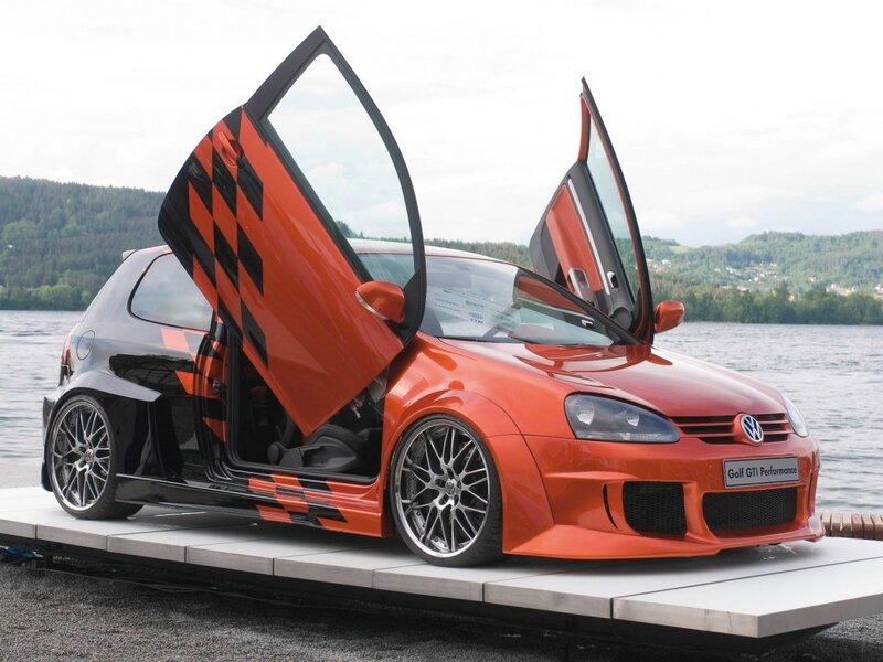 Orange Volkswagen Golf GTI with gullwing doors