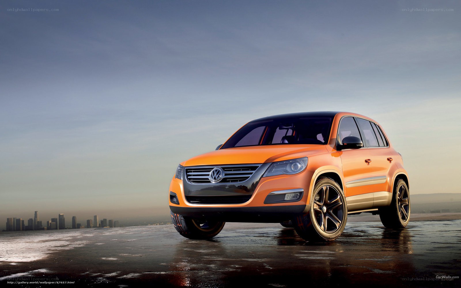 Orange Volkswagen SUV on wet surface