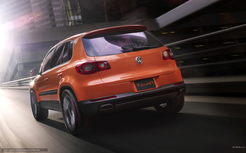 Orange Volkswagen Tiguan in motion