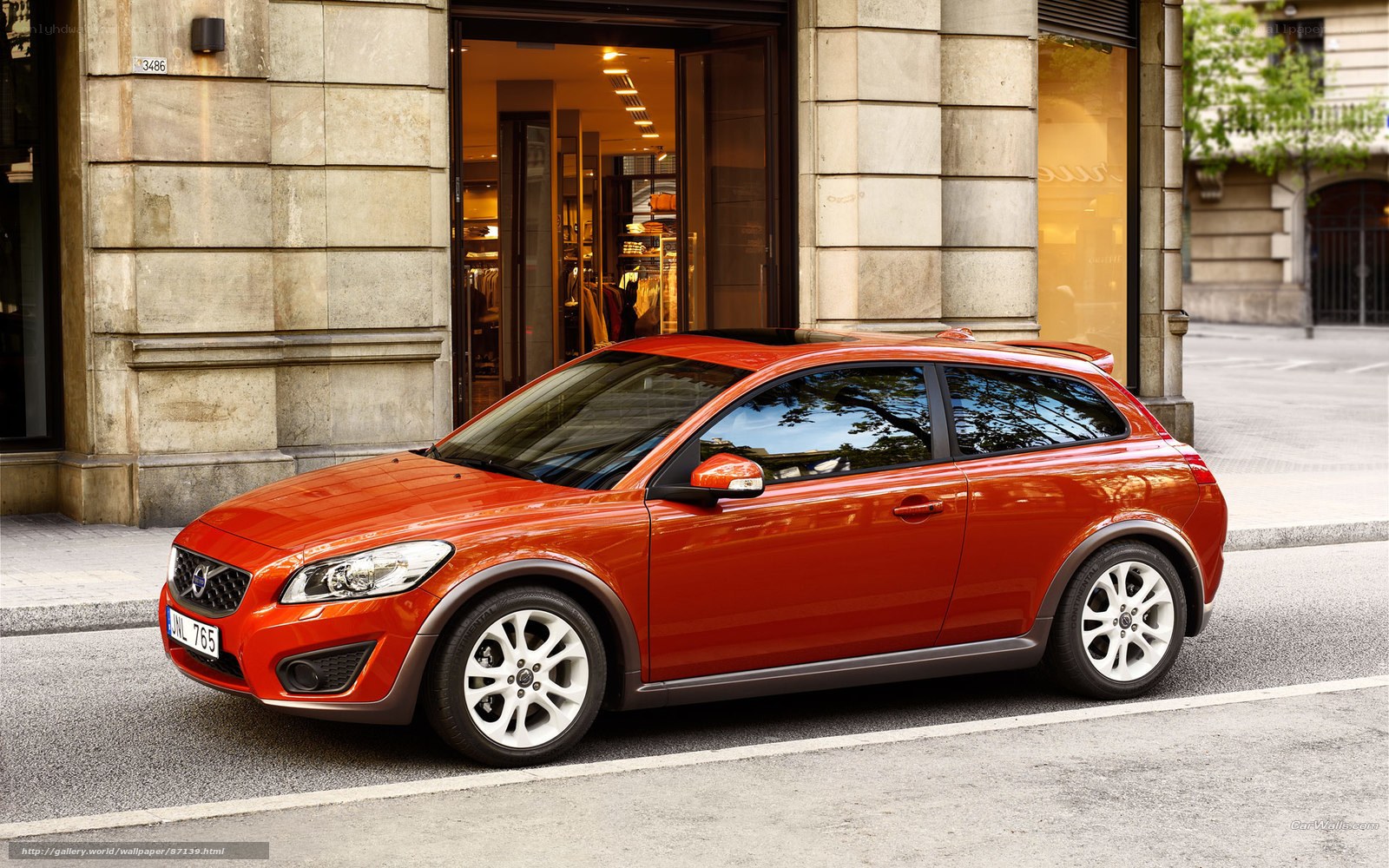 Orange Volvo C30 parked on street