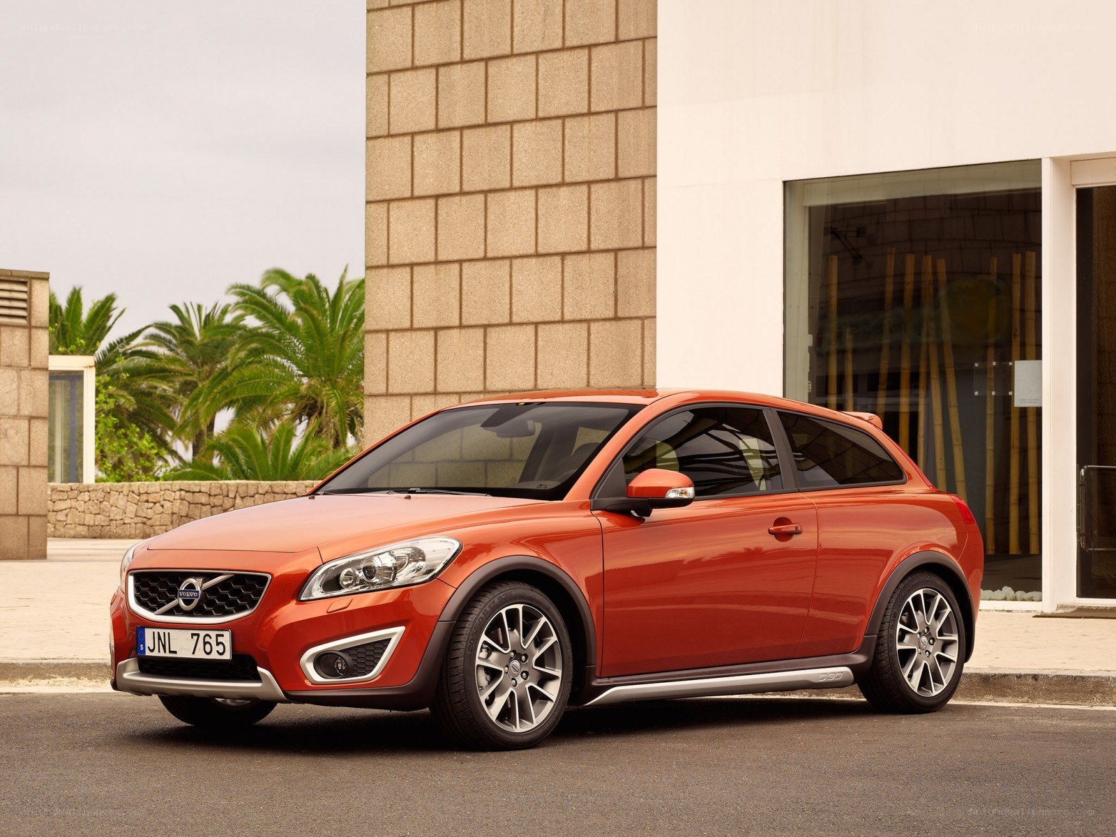Orange Volvo C30 parked outside
