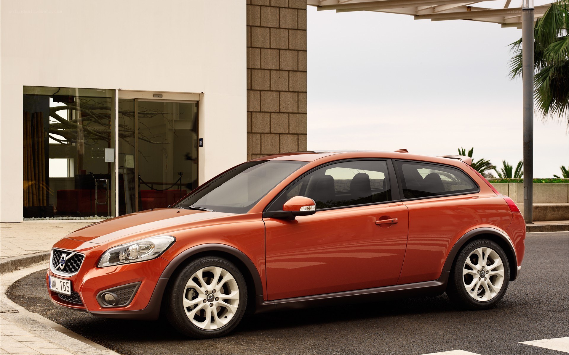 Orange Volvo C30 parked outside