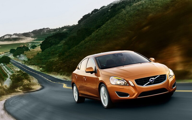 Orange Volvo on winding road