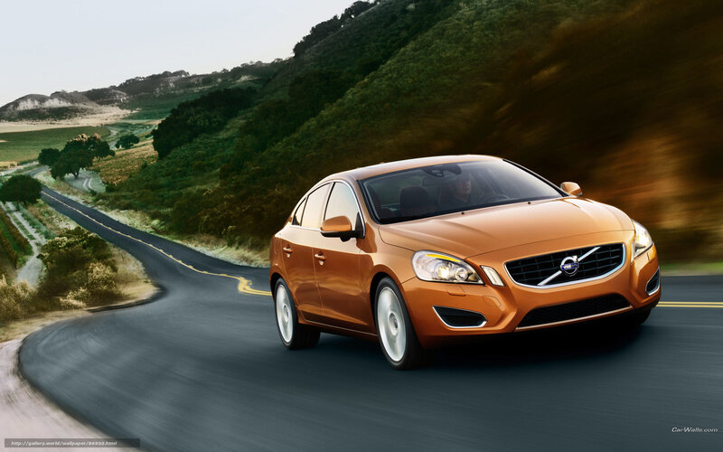 Orange Volvo on winding road
