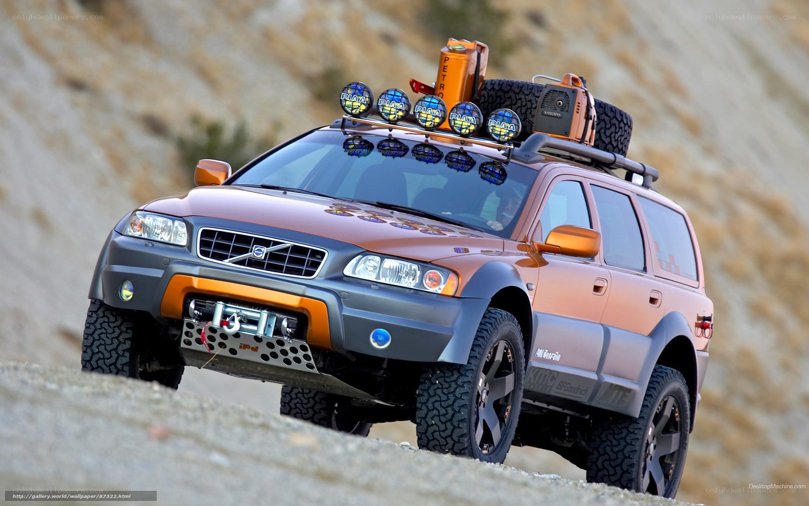 orange volvo suv off-road