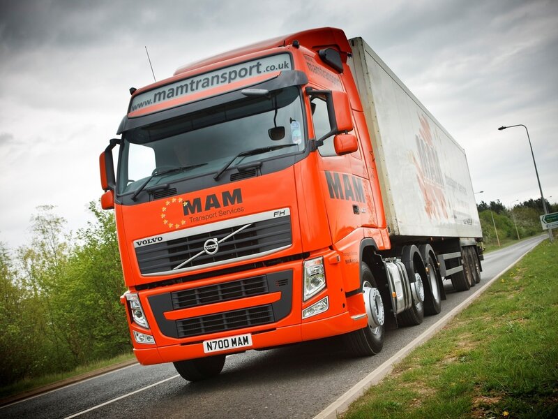 Orange Volvo Truck — Dramatic