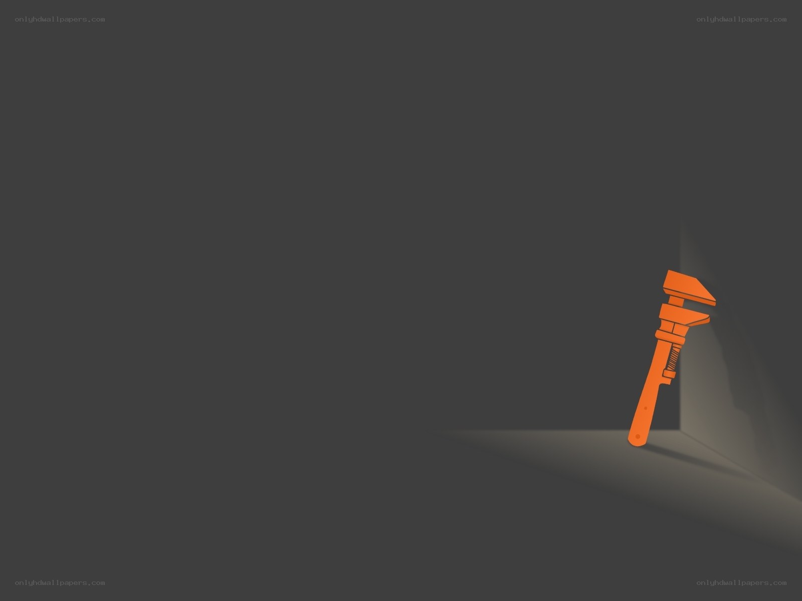 orange wrench in corner