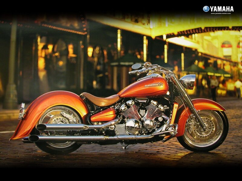 Orange Yamaha motorcycle at night