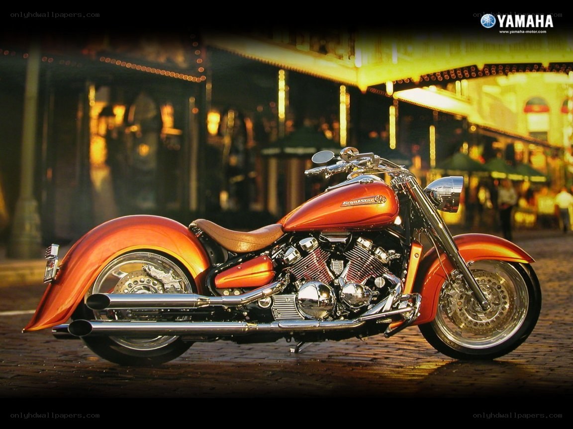 Orange Yamaha motorcycle at night
