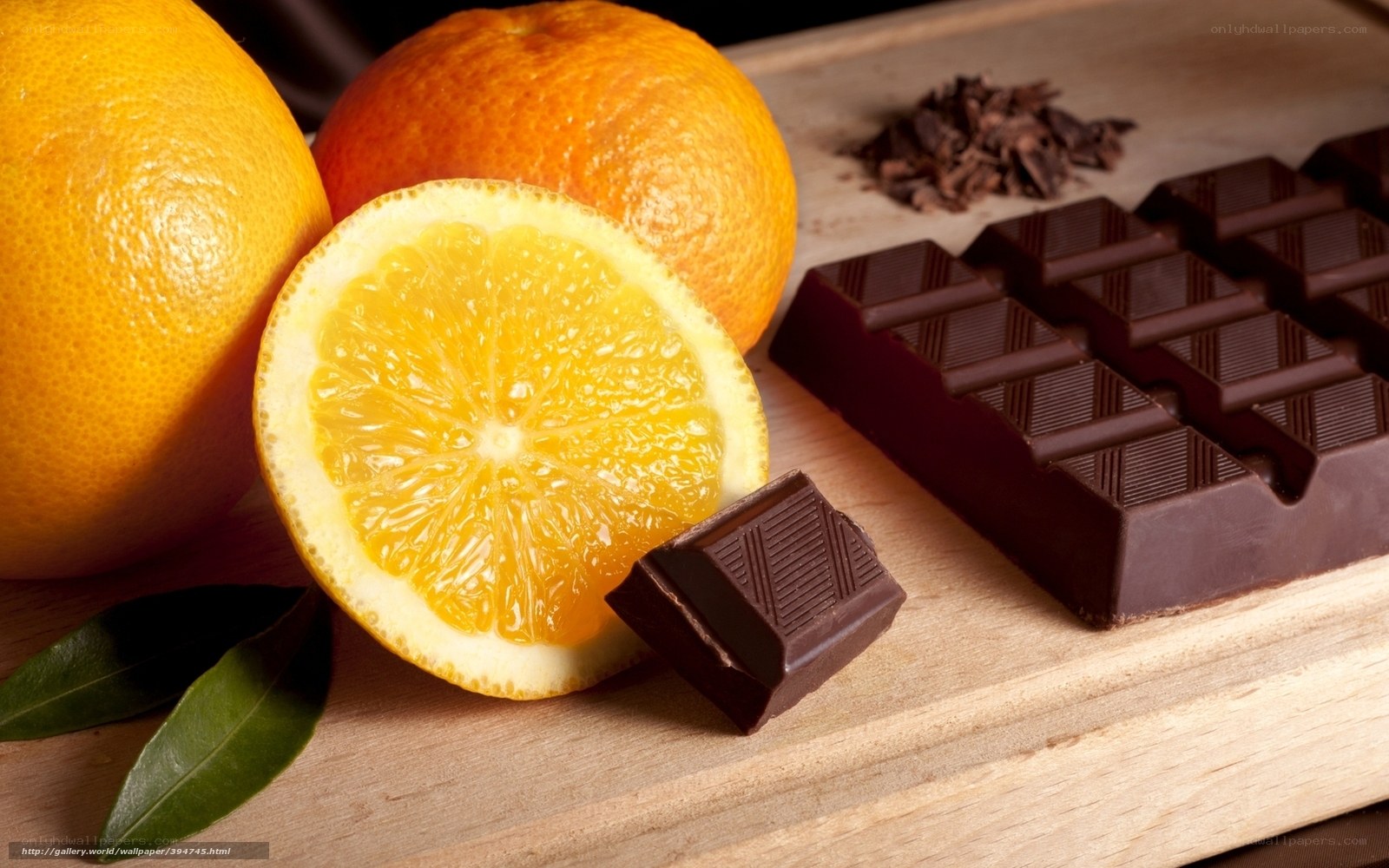 Oranges and chocolate on wood