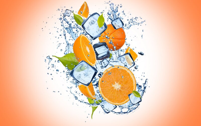 Oranges and ice in water splash
