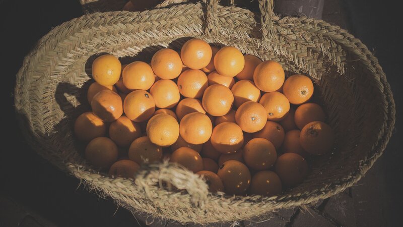 Oranges in a Basket — Orange, Dramatic