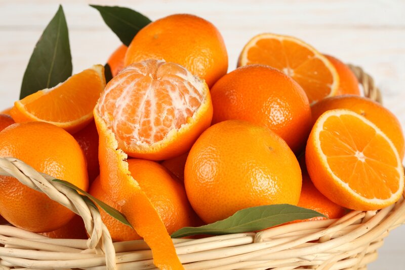 Oranges in a Basket — Orange, Fresh, Photograph, Leaves