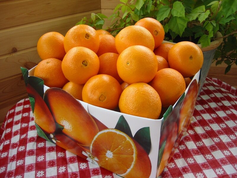 Oranges in a box on table