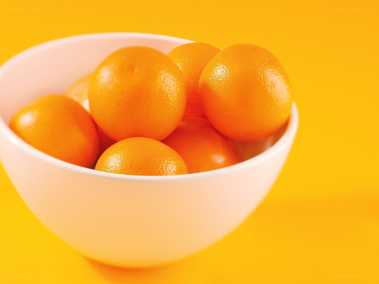 Oranges in a white bowl