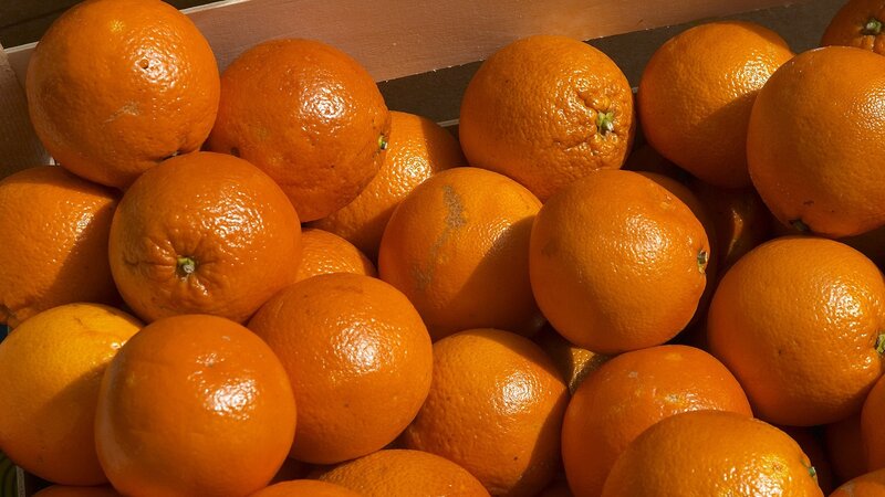 Oranges in a wooden crate