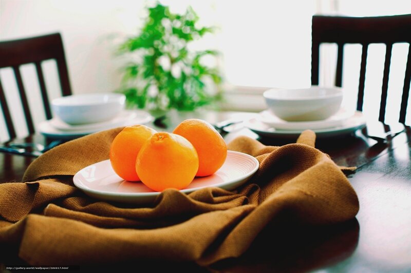 Oranges on a table setting
