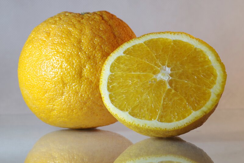 Oranges on reflective surface