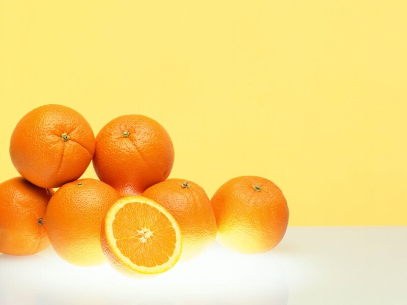 Oranges on yellow background