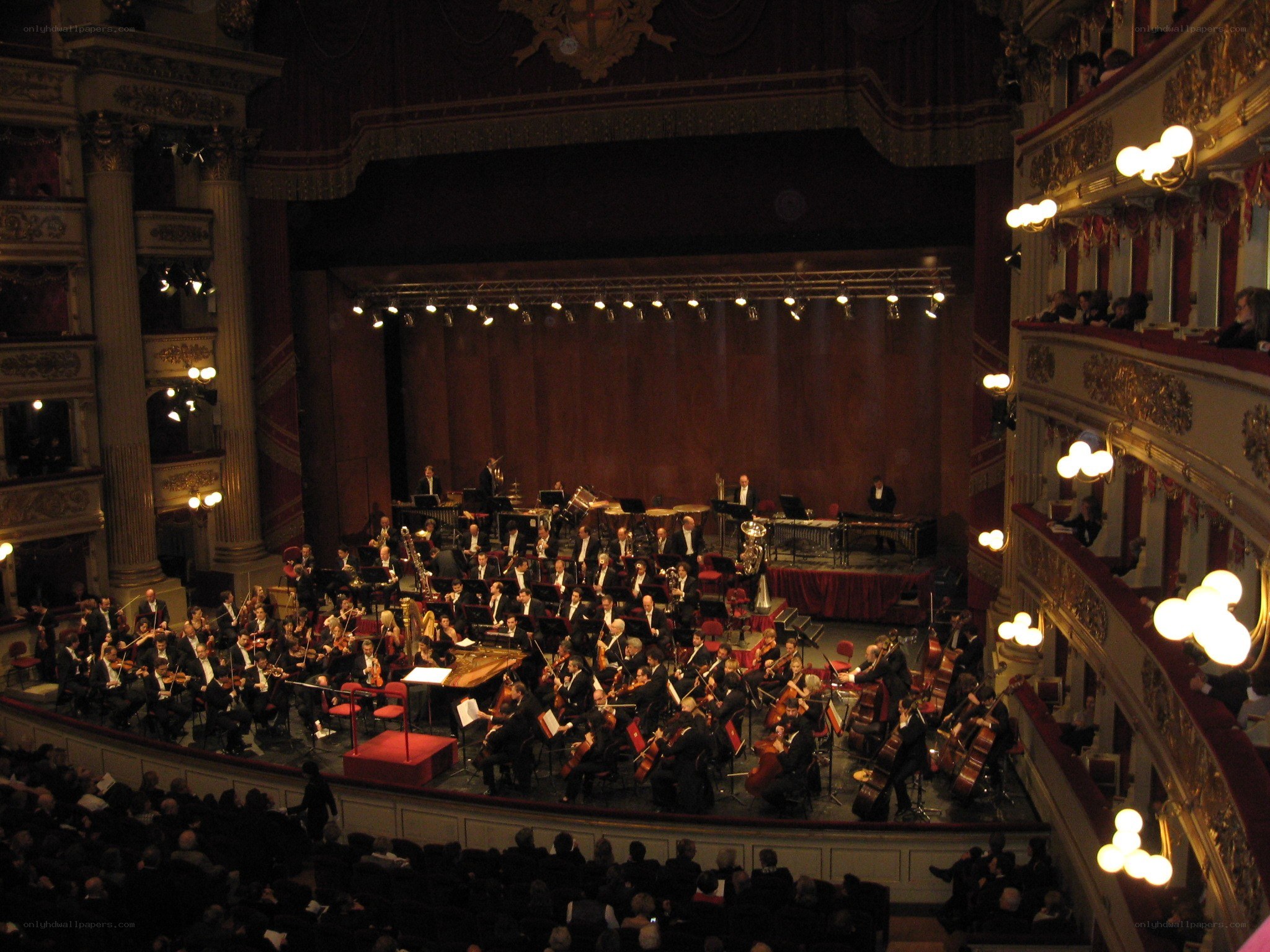 Orchestra performing in a grand theater