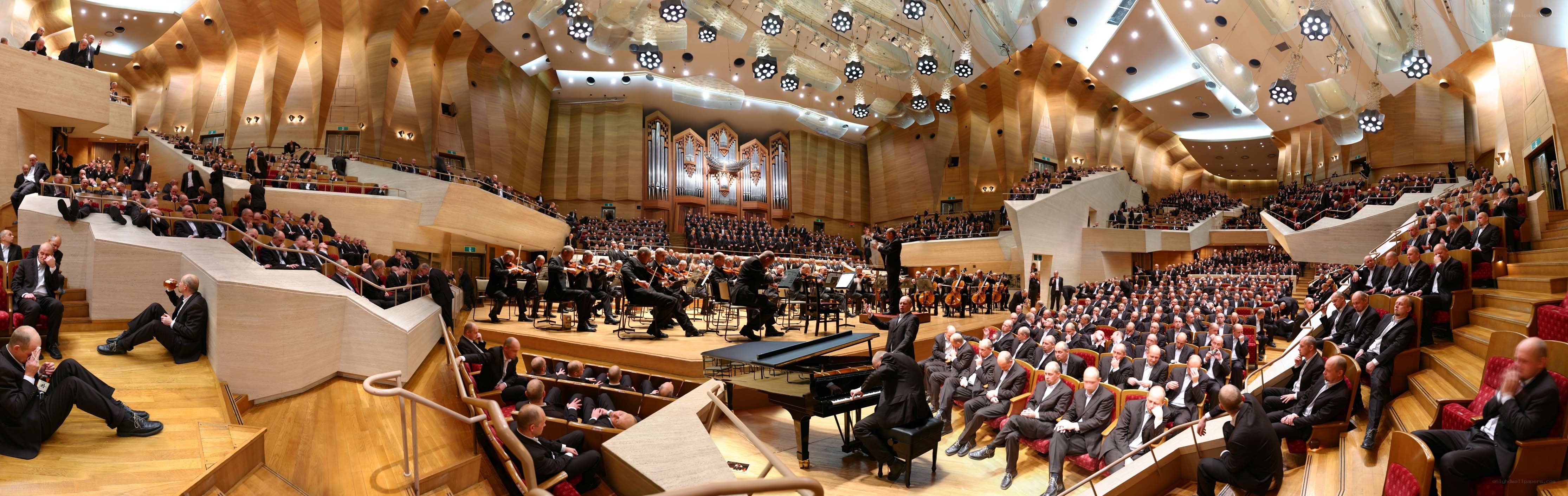 Orchestra performing in concert hall