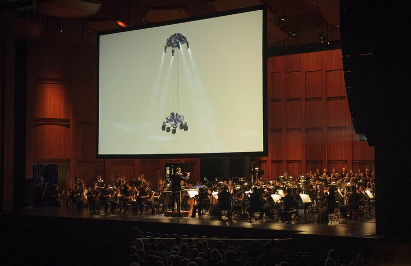 Orchestra Performing on Stage — Black, Dramatic