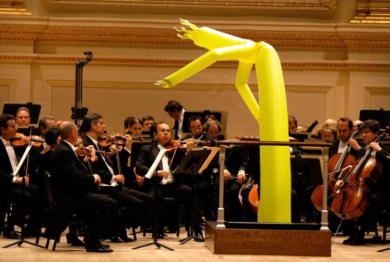 Orchestra with inflatable figure