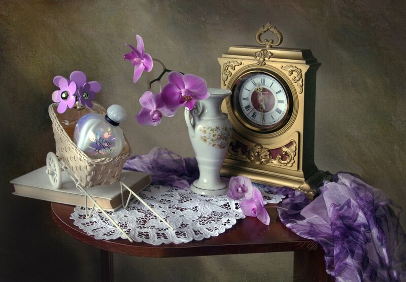 Orchid and Perfume on Table