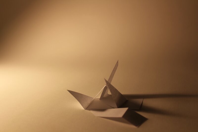 Origami crane on warm background