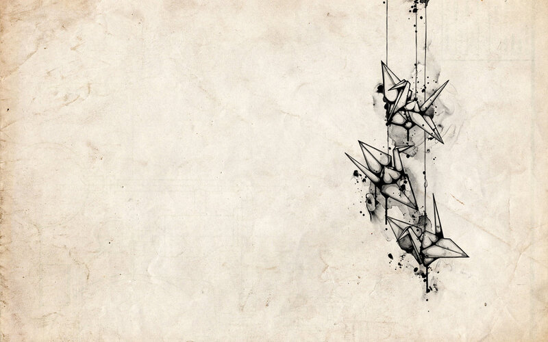origami cranes on parchment