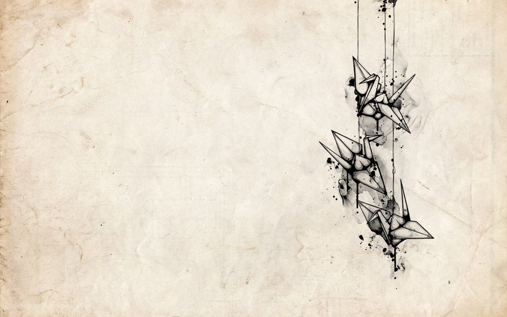 origami cranes on parchment