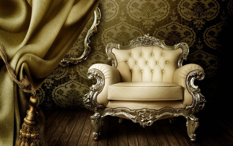 ornate armchair in golden room