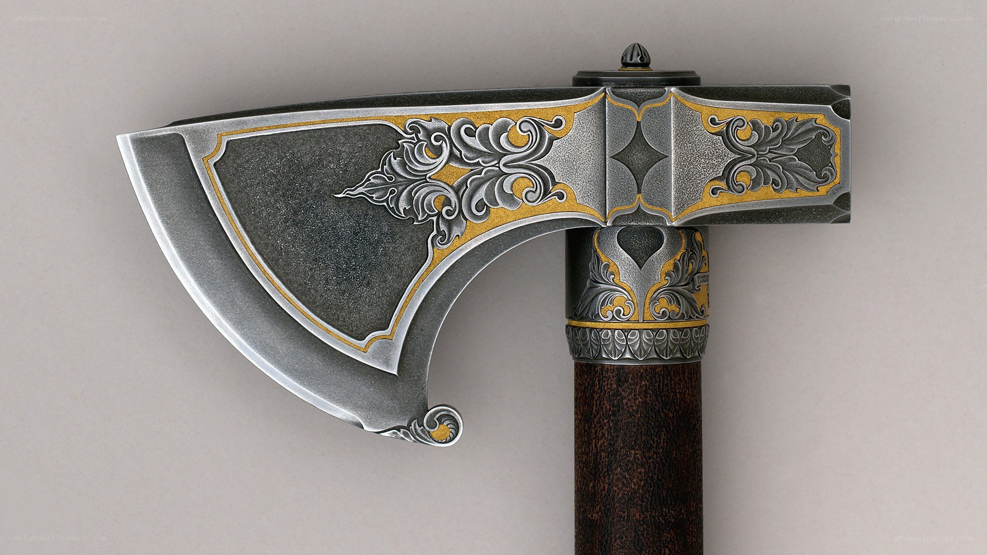 ornate axe with gold inlay