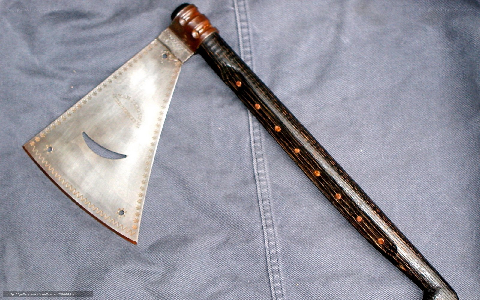 ornate axe with wooden handle