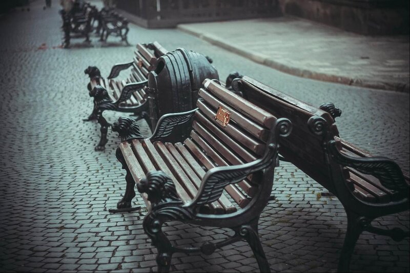 Ornate Benches on Cobblestones