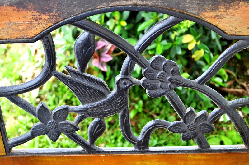ornate bird and flower bench detail