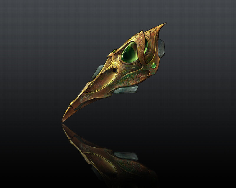 ornate bird mask with green gem
