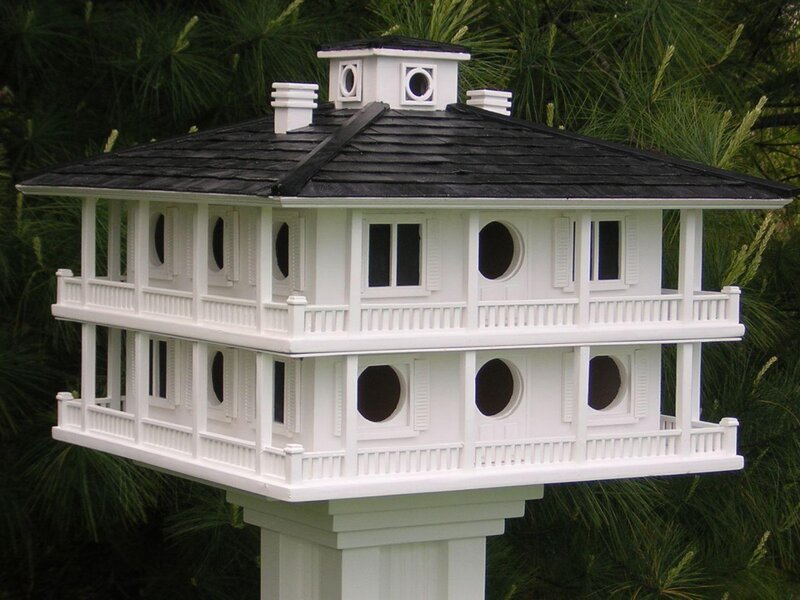 ornate birdhouse with black roof