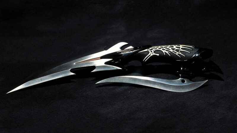 ornate black and silver dagger